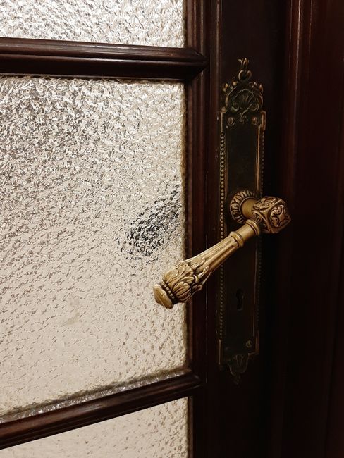 Classic office door with dark wood and brass hardware